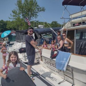 happy people on boat and dock